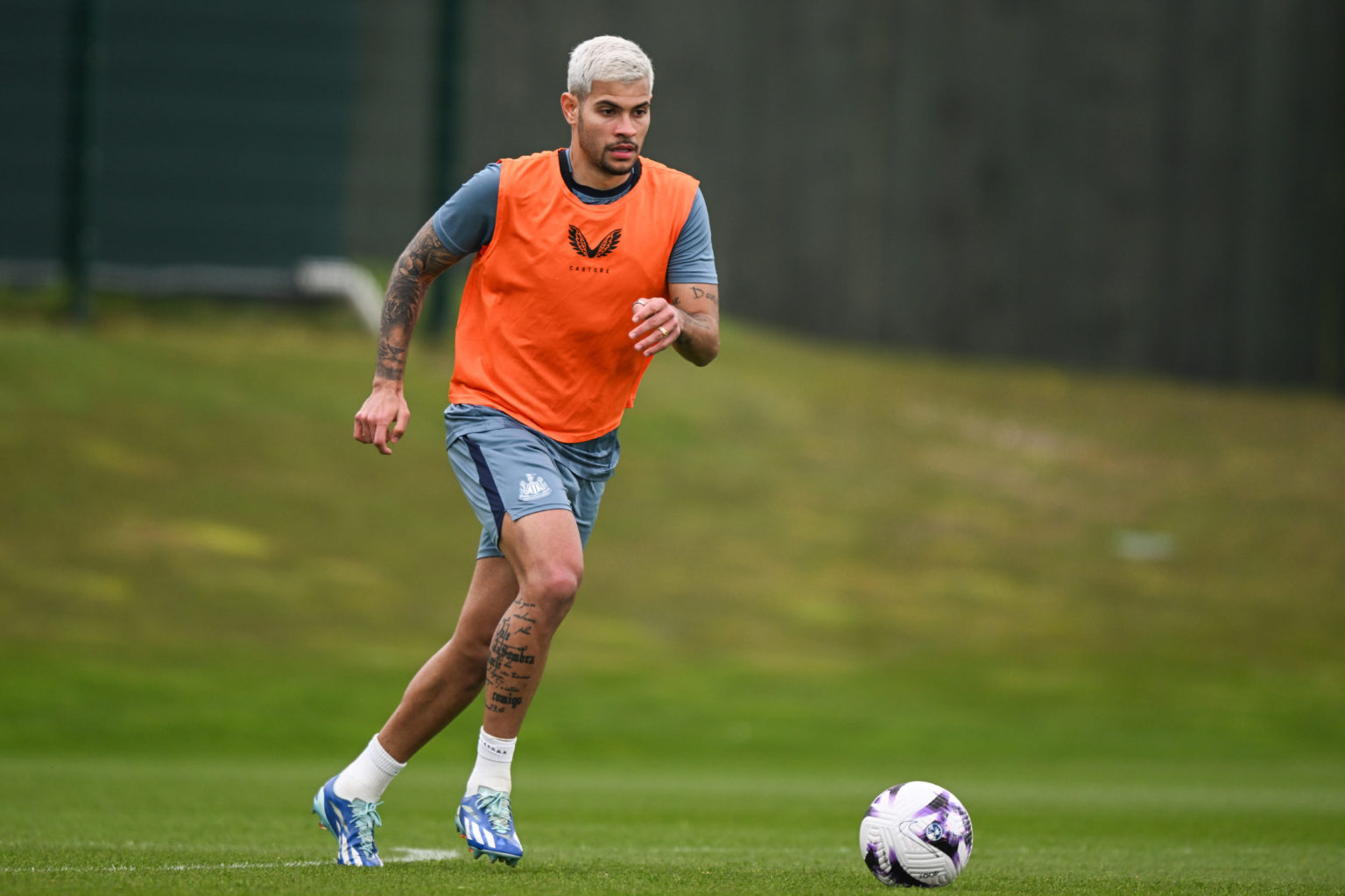 Bruno Guimaraes looks to pass the ball  during the Newcastle United Training session at the Newcastle United Training Centre on May 01, 2024 in New...