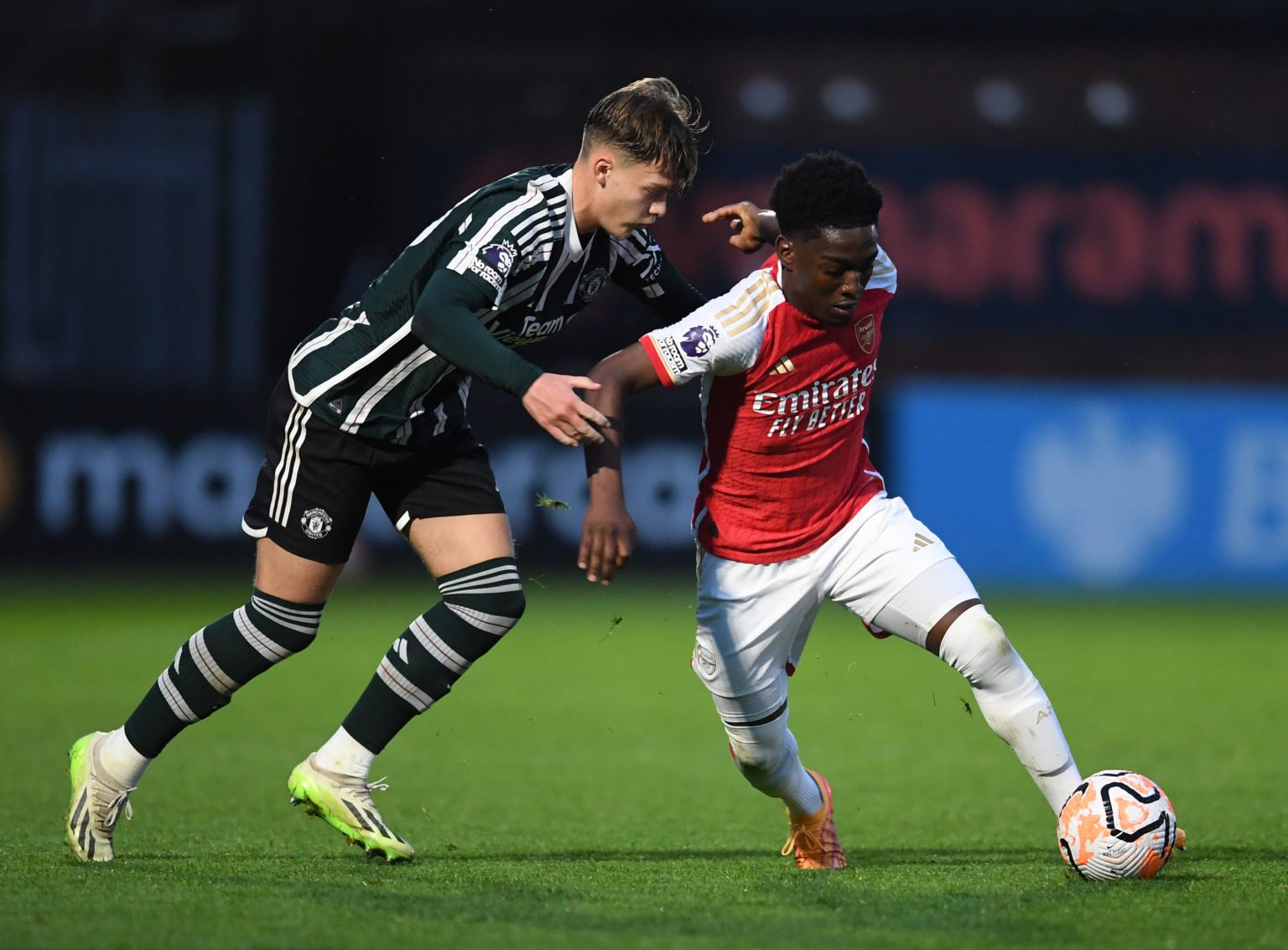 Amario Cozier-Duberry of Arsenal takes on Sam Mather of Man Utd during the PL2 Play off between Arsenal U21 and Manchester United U21 at Meadow Par...