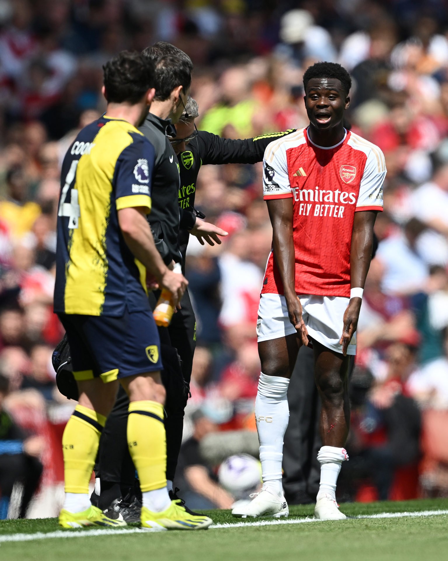 Bukayo Saka of Arsenal reacts towards Fourth Official Darren England during the Premier League match between Arsenal FC and AFC Bournemouth at Emir...