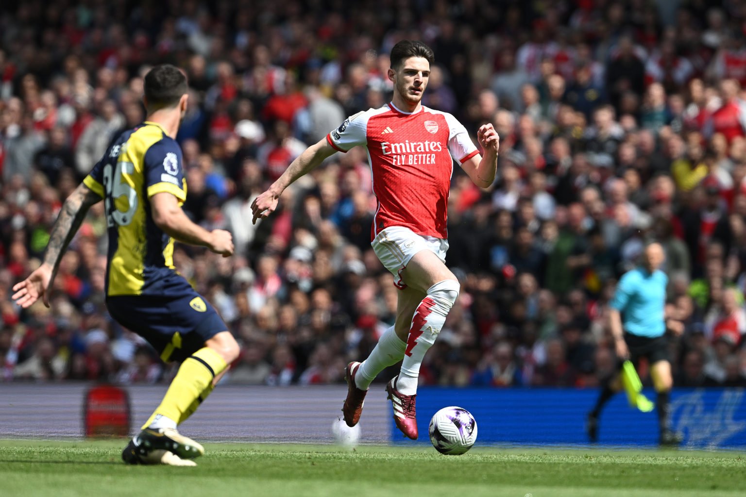 Declan Rice of Arsenal runs with the ball during the Premier League match between Arsenal FC and AFC Bournemouth at Emirates Stadium on May 04, 202...