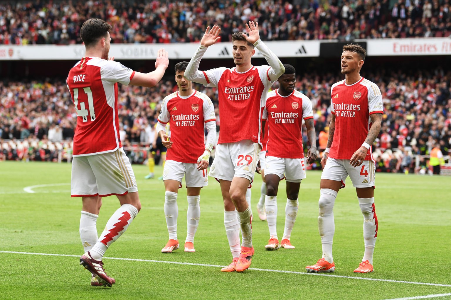 Declan Rice of Arsenal celebrates scoring his team's third goal with teammate Kai Havertz during the Premier League match between Arsenal FC and AF...