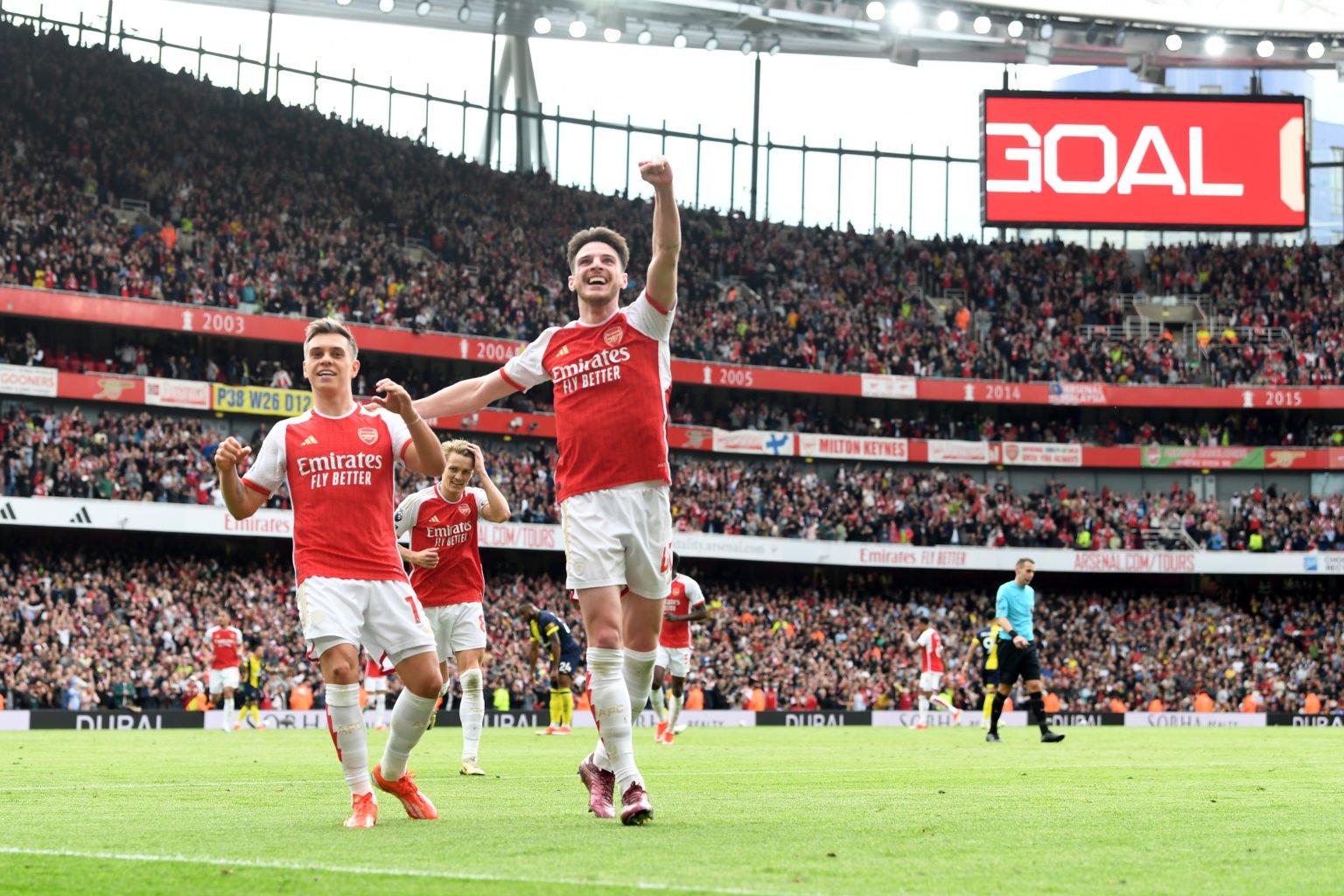 Leandro Trossard of Arsenal celebrates scoring his team's second goal with teammate Declan Rice during the Premier League match between Arsenal FC ...