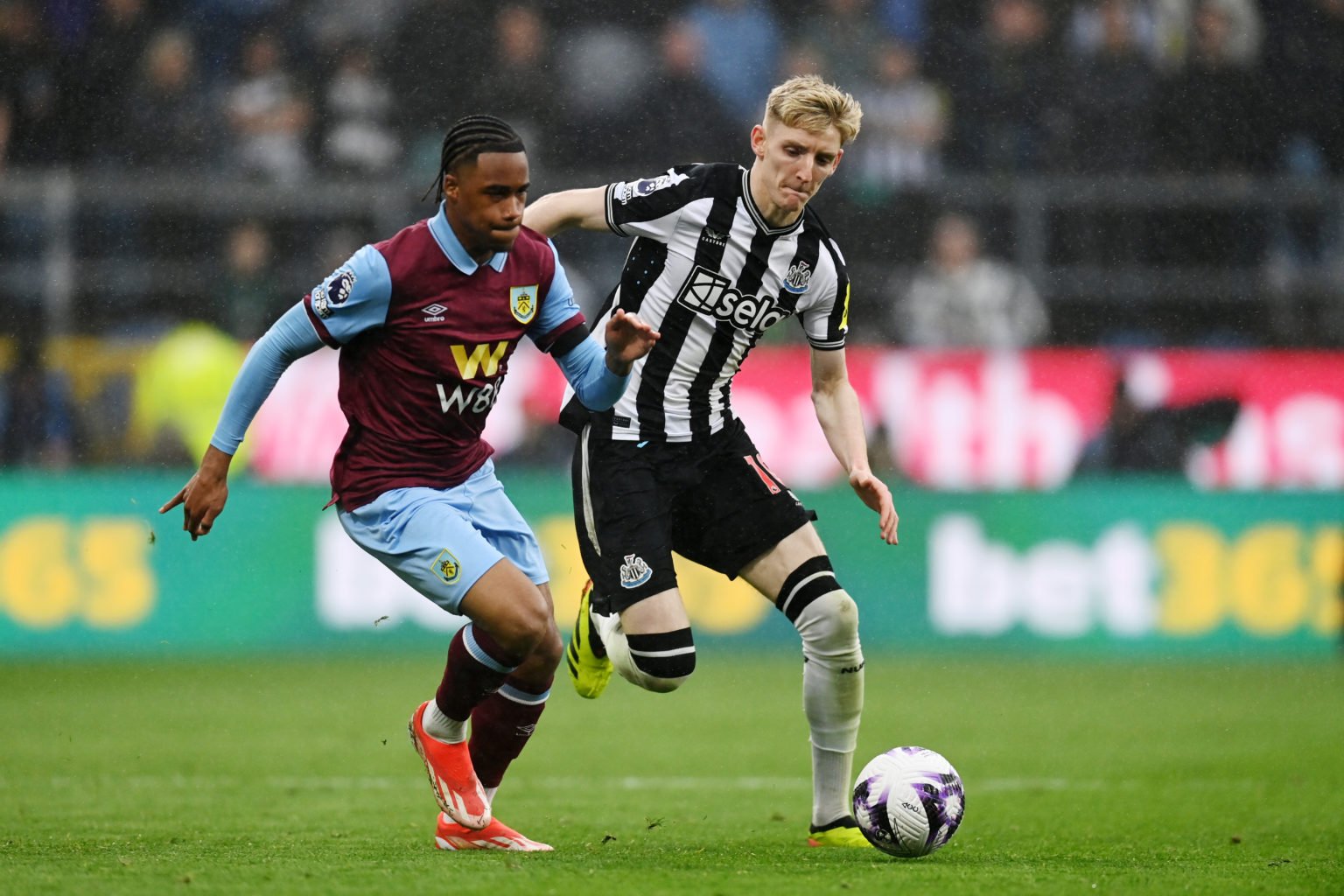 Wilson Odobert of Burnley battles for possession with Anthony Gordon of Newcastle United during the Premier League match between Burnley FC and New...