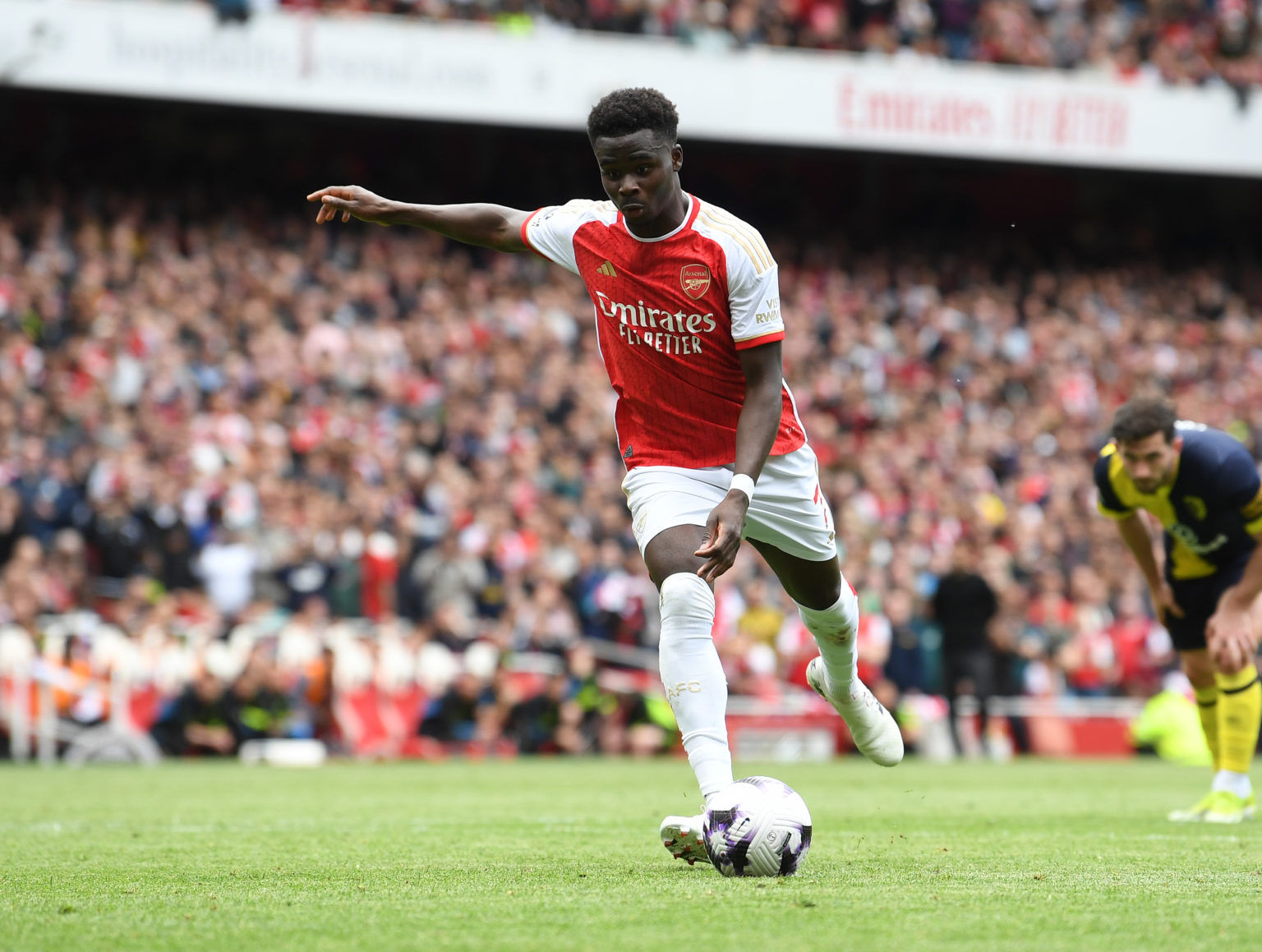 Bukayo Saka scores Arsenal's 1st goal from the penalty spot during the Premier League match between Arsenal FC and AFC Bournemouth at Emirates Stad...