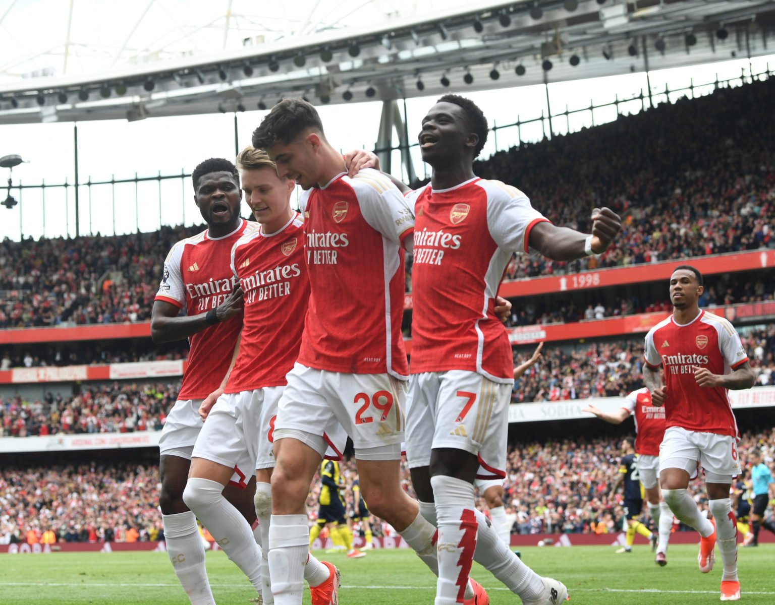 (R) Bukayo Saka celebrates scoring the 1st Arsenal goal with (L) Thomas Partey, (2ndL) Martin Odegaard and (2ndR) Kai Havertz during the Premier Le...