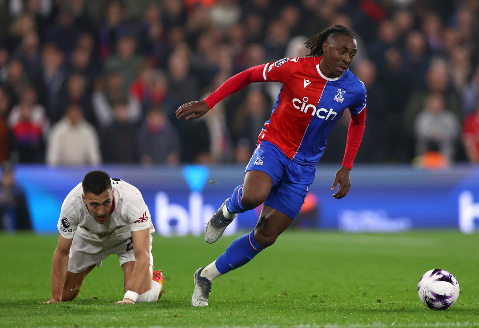 Diogo Dalot of Manchester United and Eberchi Eze of Crystal Palace in action  during the Premier League match between Crystal Palace and Manchester...