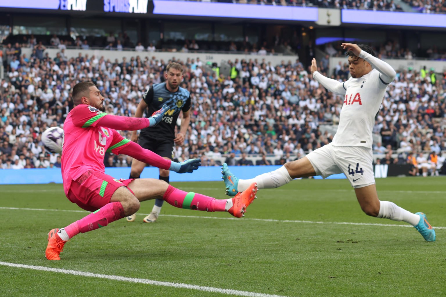 the ball evades both Burnley goalkeeper Arijanet Muric and Dane Scarlett of Tottenham Hotspur during the Premier League match between Tottenham Hot...