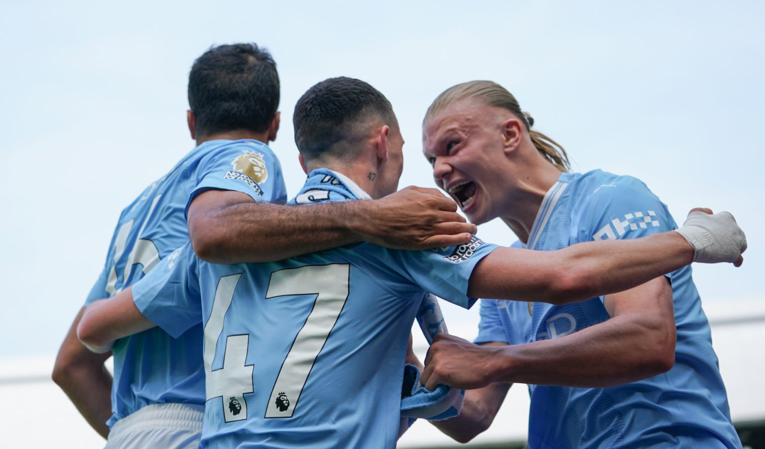 Manchester City's Phil Foden celebrates scoring his side's second goal with team-mate Erling Haland during the Premier League match between Fulham ...