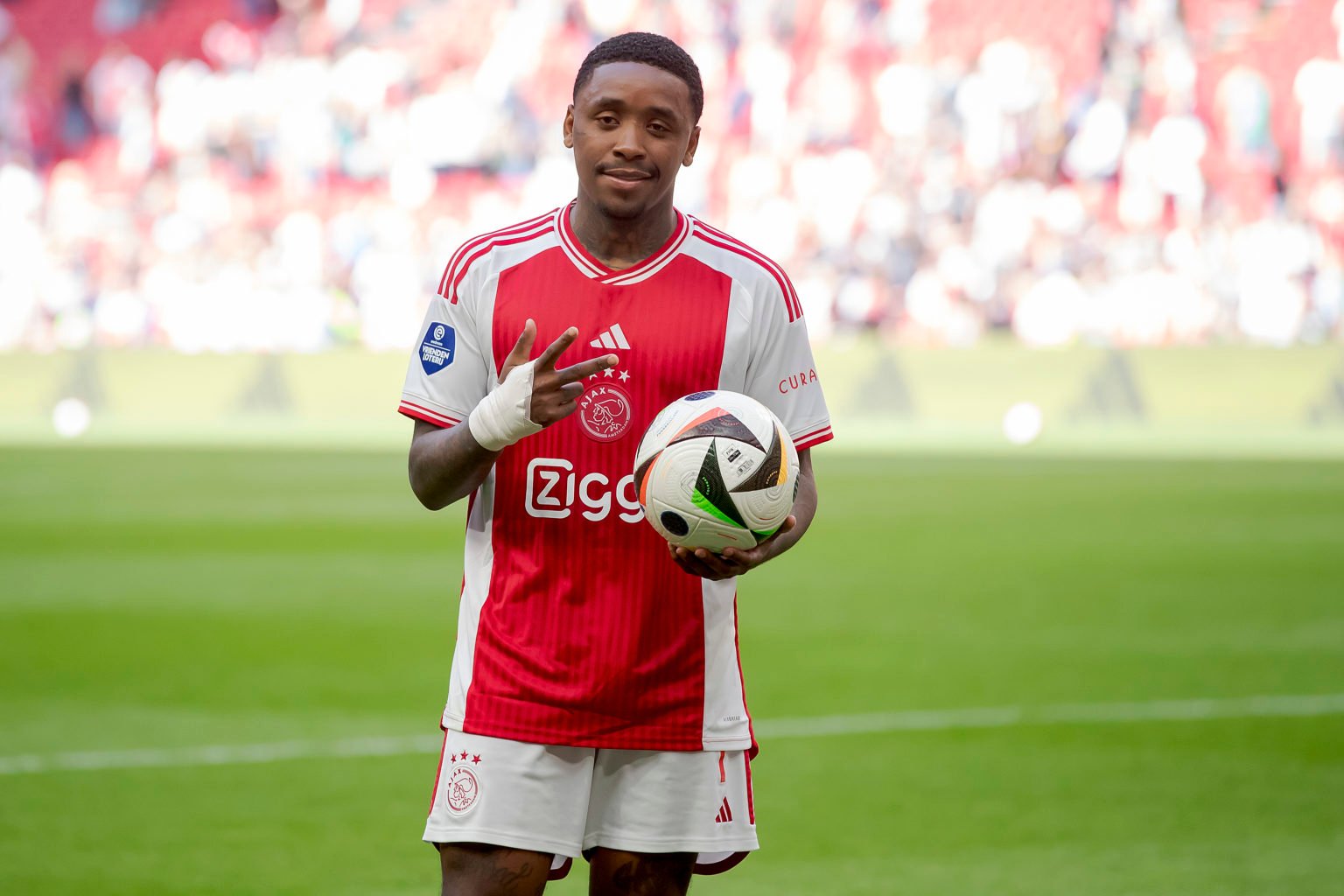 Steven Bergwijn of Ajax with the matchball after scoring three goals during the Dutch Eredivisie  match between Ajax v Almere City at the Johan Cru...