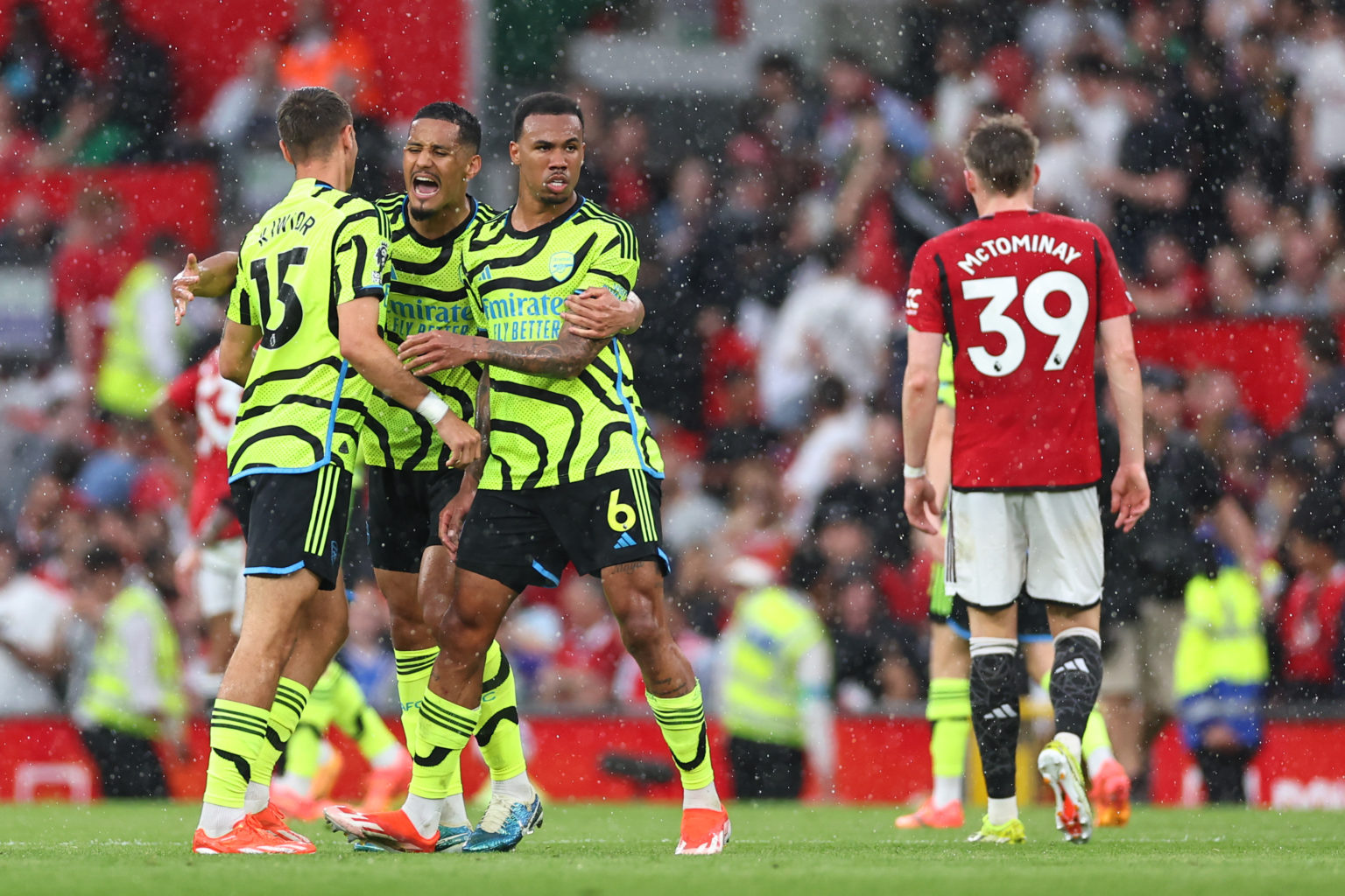 Gabriel Magalhaes and William Saliba of Arsenal celebrate at full time during the Premier League match between Manchester United and Arsenal FC at ...