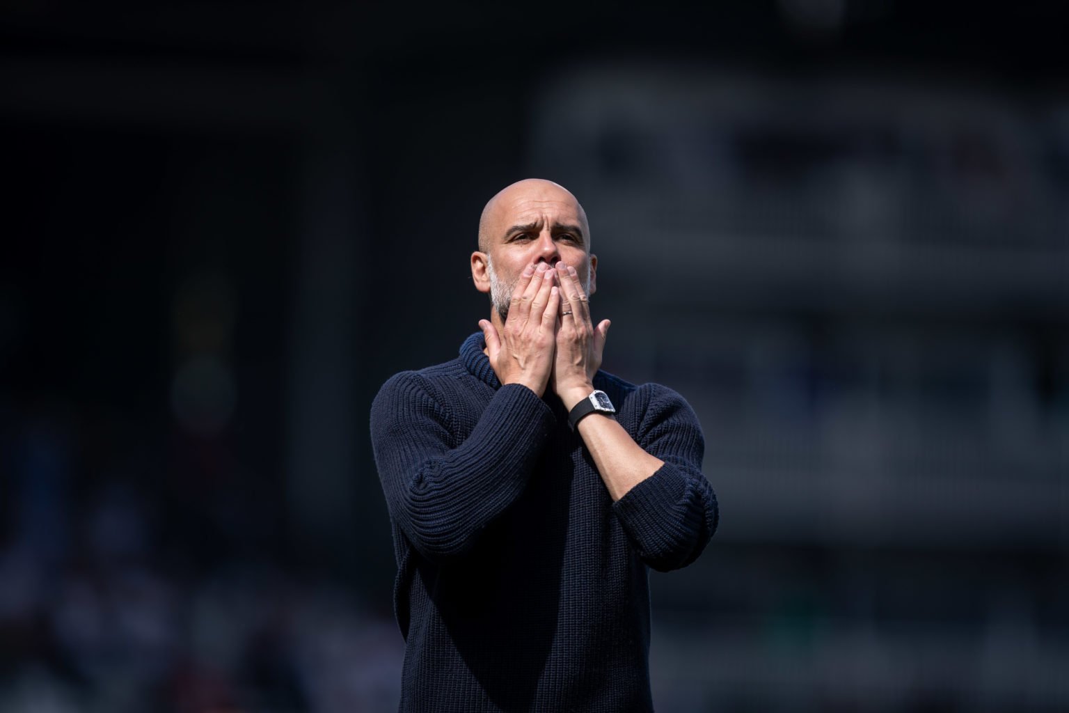 Pep Guardiola of Manchester City is blowing a kiss to their fans after the Premier League match between Fulham and Manchester City at Craven Cottag...