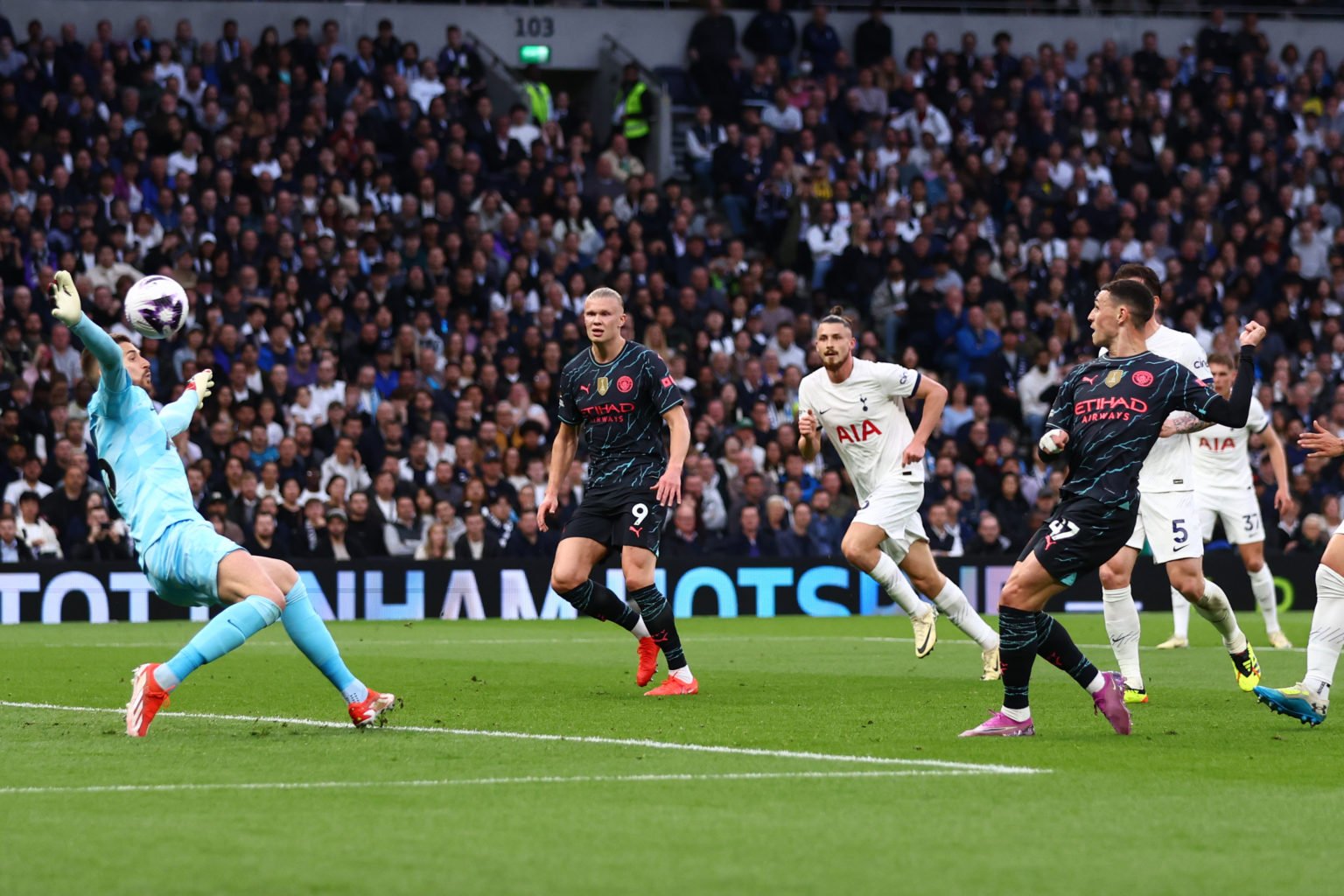 Guglielmo Vicario of Tottenham Hotspur saves from Phil Foden of Manchester City during the Premier League match between Tottenham Hotspur and Manch...