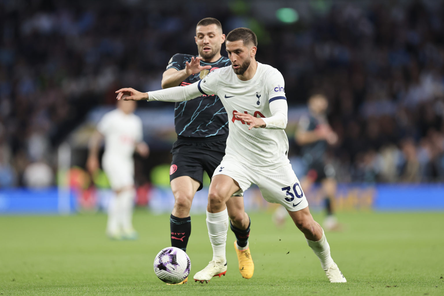 Rodrigo Bentancur of Tottenham Hotspur and Mateo Kovacic of Manchester City during the Premier League match between Tottenham Hotspur and Mancheste...