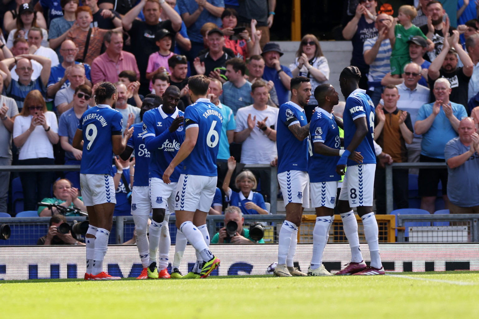 Abdoulaye Doucoure of Everton celebrates scoring his team's first goal with teammates during the Premier League match between Everton FC and Sheffi...