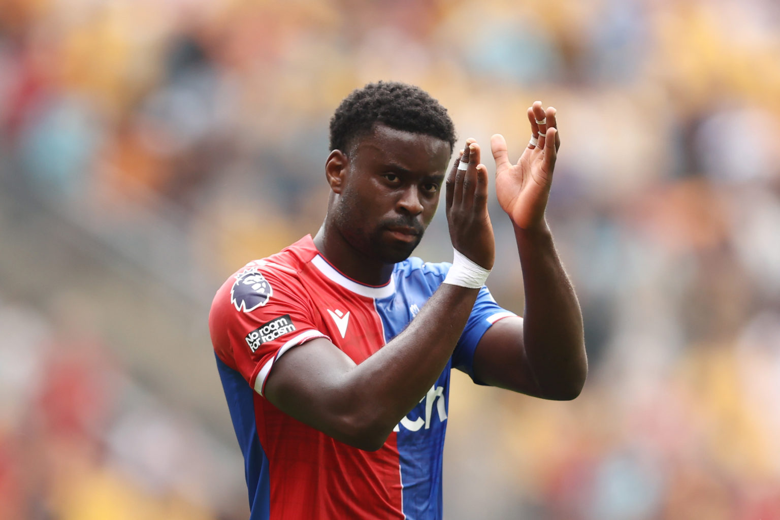 Marc Guehi of Crystal Palace applauds the fans after the Premier League match between Wolverhampton Wanderers and Crystal Palace at Molineux on May...