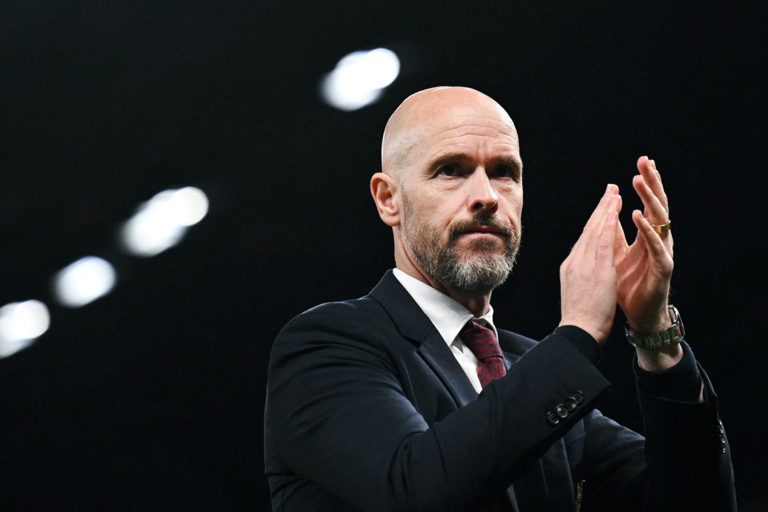 Manchester United's Dutch manager Erik ten Hag applauds as  he leaves the pitch at the end of the English Premier League football match between Man...