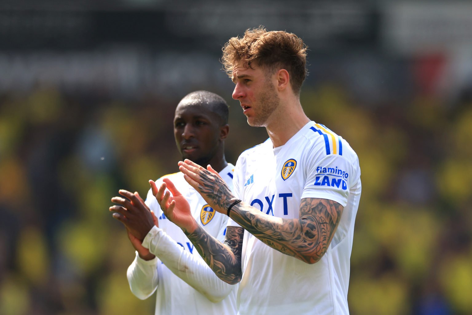 Joe Rodon and Glen Kamara of Leeds United applaud fans following the Sky Bet Championship Play-Off Semi-Final 1st Leg match between Norwich City an...