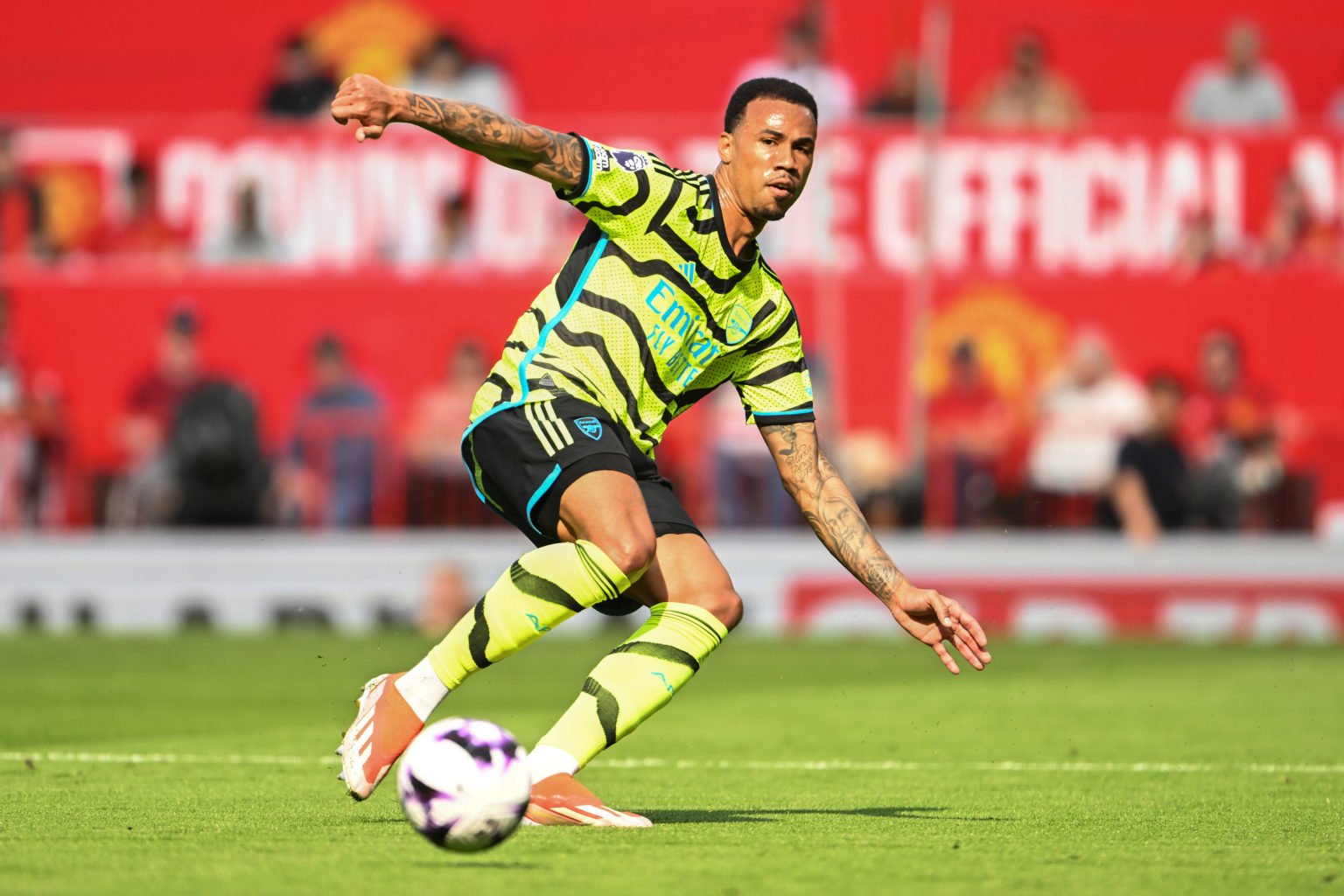 Gabriel of Arsenal passes the ball during the Premier League match between Manchester United and Arsenal FC at Old Trafford on May 12, 2024 in Manc...