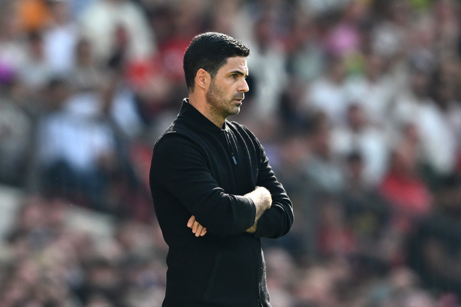 Mikel Arteta, Manager of Arsenal, looks on during the Premier League match between Manchester United and Arsenal FC at Old Trafford on May 12, 2024...