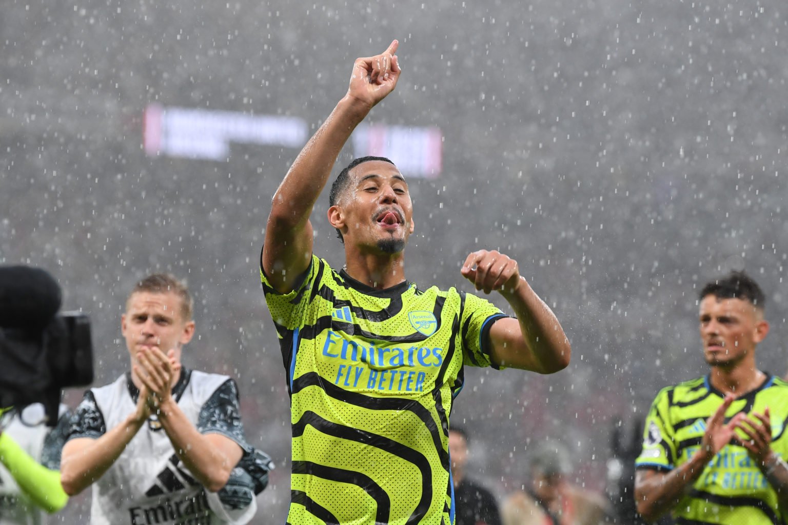 William Saliba of Arsenal celebrates victory with teammates after defeating Manchester United during the Premier League match between Manchester Un...