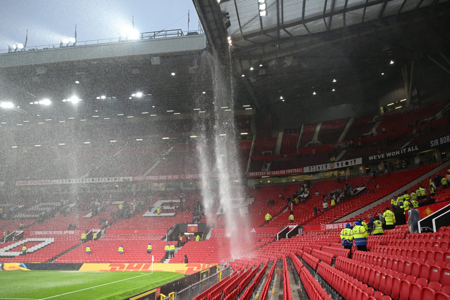 A general view as the drainage pipe in the roofs of the Sir Alex Ferguson Stand and East Stand leaks and pours onto the seats below following heavy...