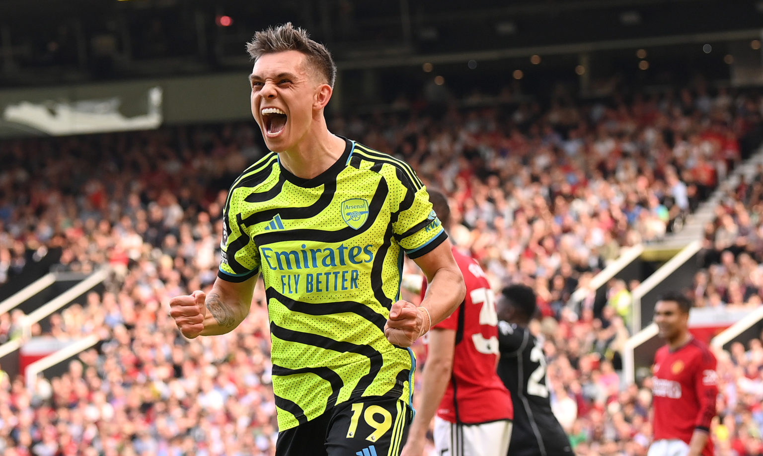 Leandro Trossard of Arsenal celebrates scoring his team's first goal during the Premier League match between Manchester United and Arsenal FC at Ol...