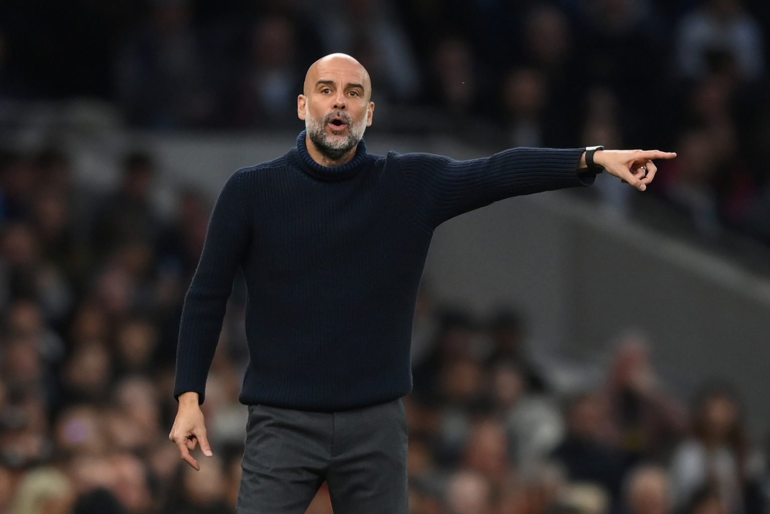 Pep Guardiola, Manager of Manchester City, gives the team instructions during the Premier League match between Tottenham Hotspur and Manchester Cit...