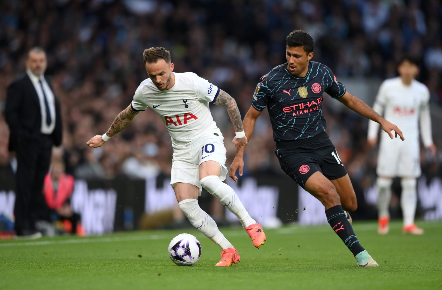 James Maddison of Tottenham Hotspur takes on Rodri of Manchester City  during the Premier League match between Tottenham Hotspur and Manchester Cit...