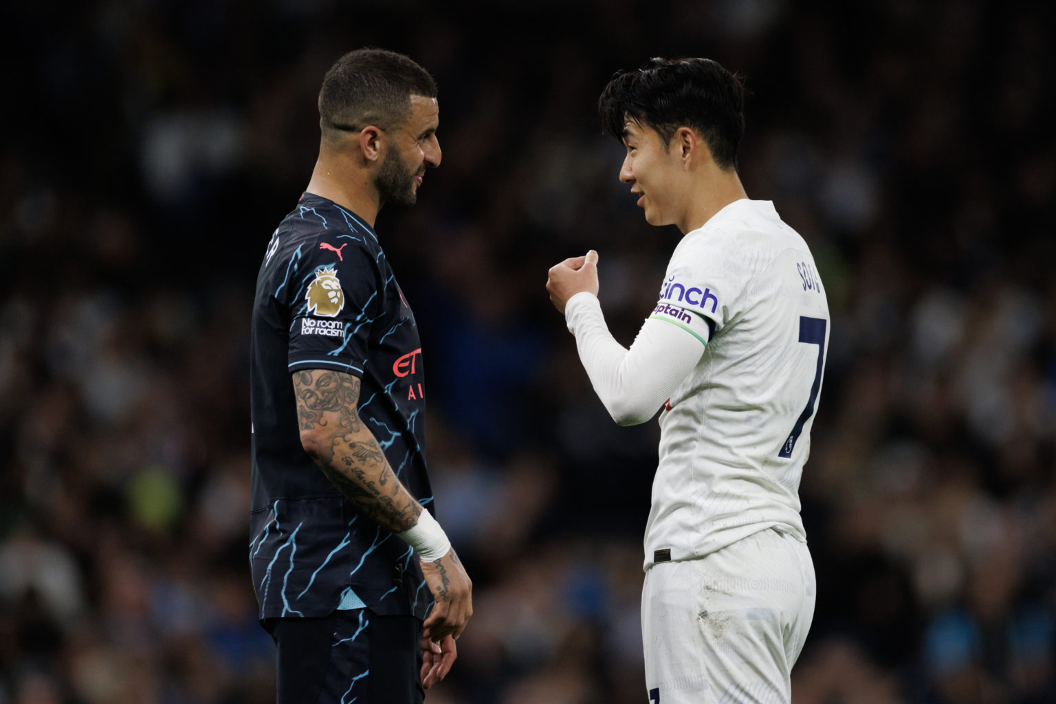 Son Heung-min of Tottenham Hotspur speaks with former team mate Kyle Walker of Manchester City during the Premier League match between Tottenham Ho...