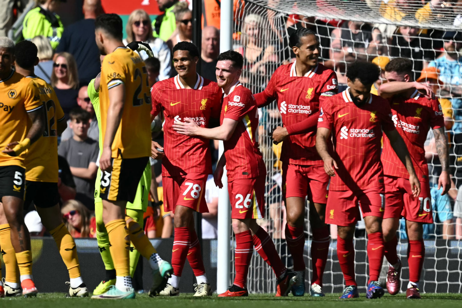 Liverpool's English defender #78 Jarell Quansah (centre left) celebrates with teammates after scoring their second goal during the English Premier ...