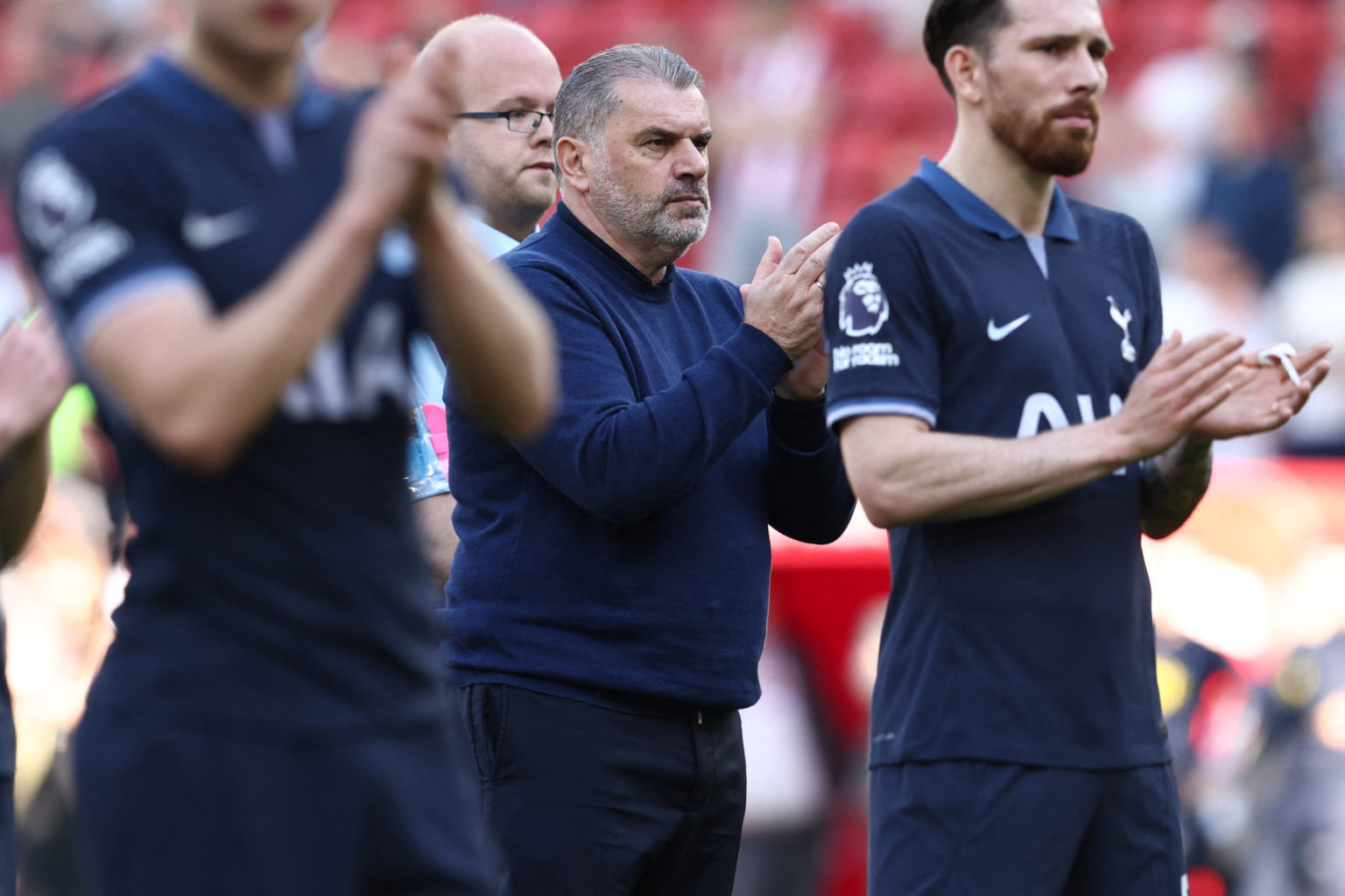 Tottenham Hotspur's Greek-Australian Head Coach Ange Postecoglou (C) greets fans following the English Premier League football match between Sheffi...