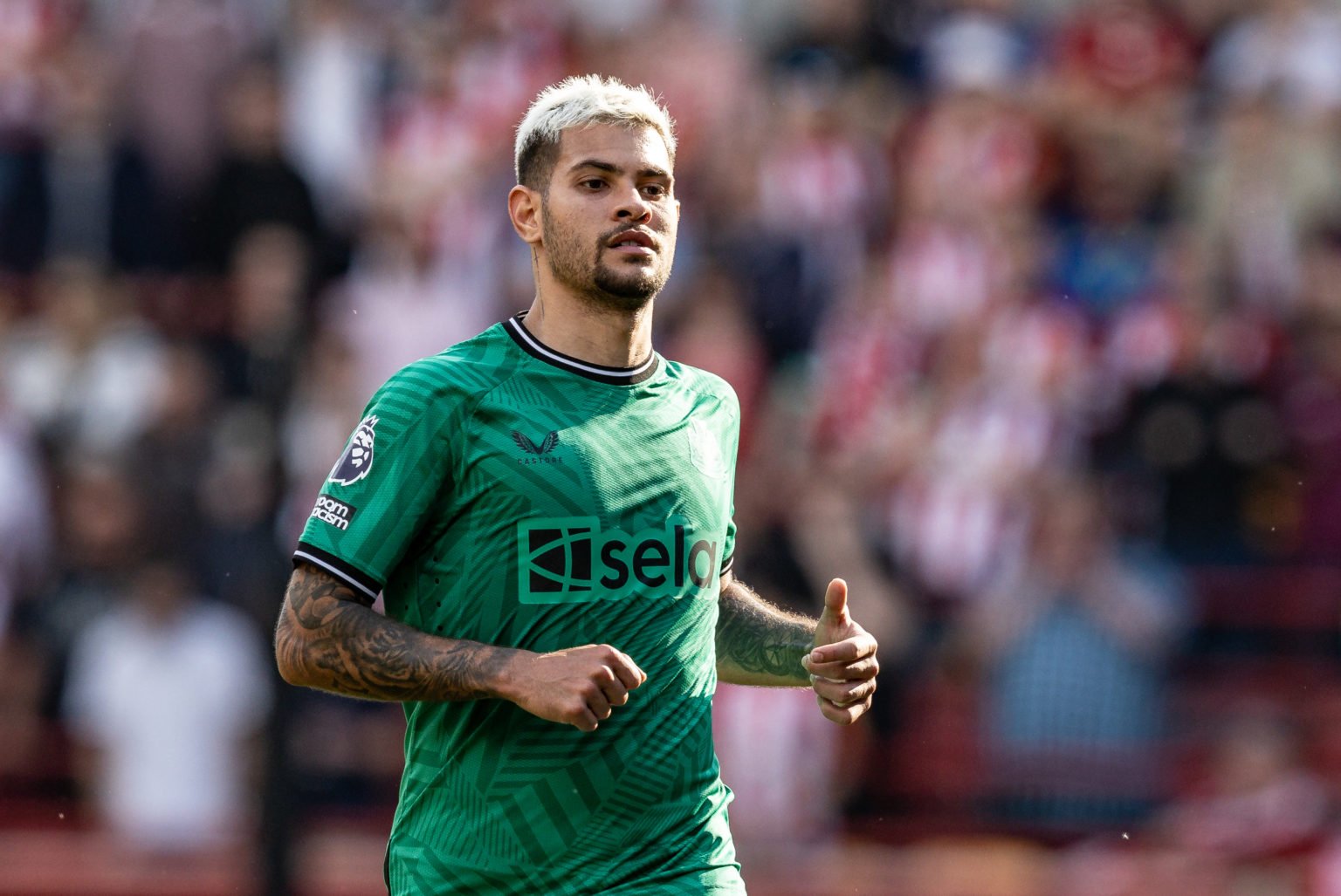 Newcastle United's Bruno Guimaraes looks on during the Premier League match between Brentford FC and Newcastle United at Brentford Community Stadiu...