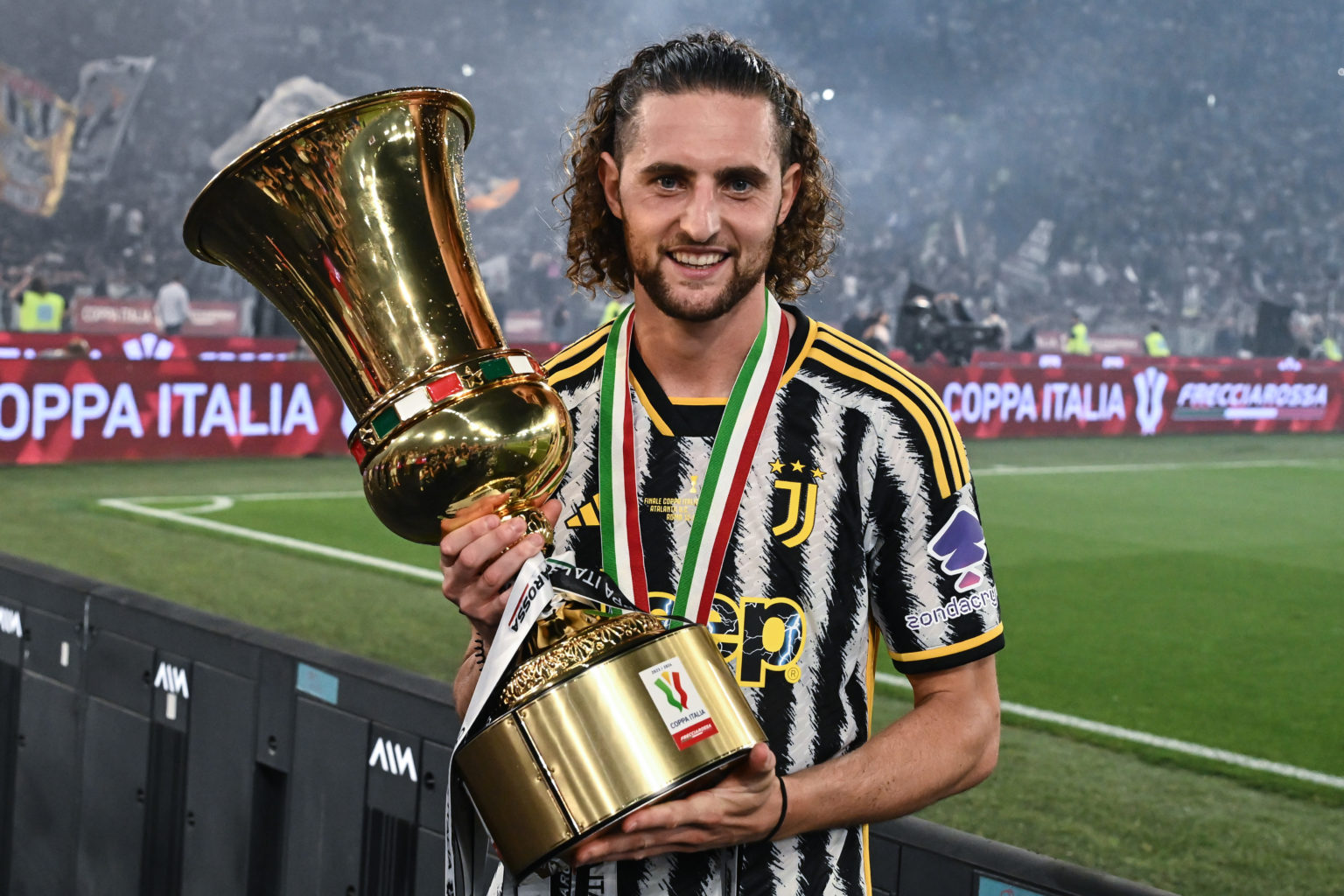 Adrien Rabiot of Juventus FC celebrate the win with the trophy during the award ceremony at the end of the Coppa Italia Final match between Atalant...