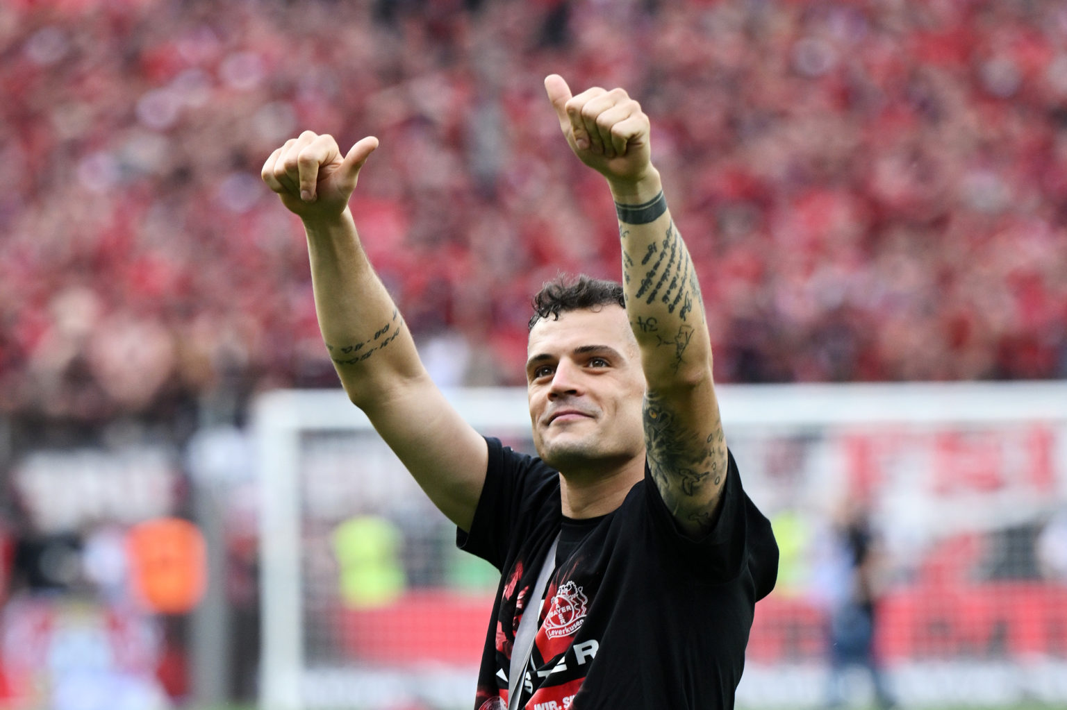 Granit Xhaka of Bayer Leverkusen celebrates with the fans after the team's victory  during the Bundesliga match between Bayer 04 Leverkusen and FC ...