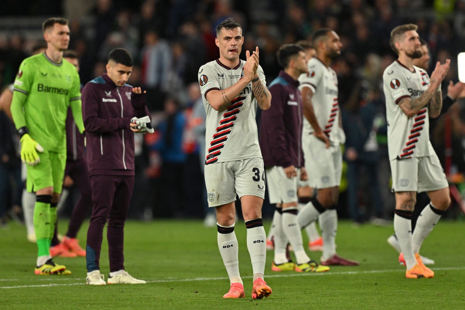 Bayer Leverkusen's Swiss midfielder #34 Granit Xhaka (C) reacts on the pitch after the UEFA Europa League final football match between Atalanta and...