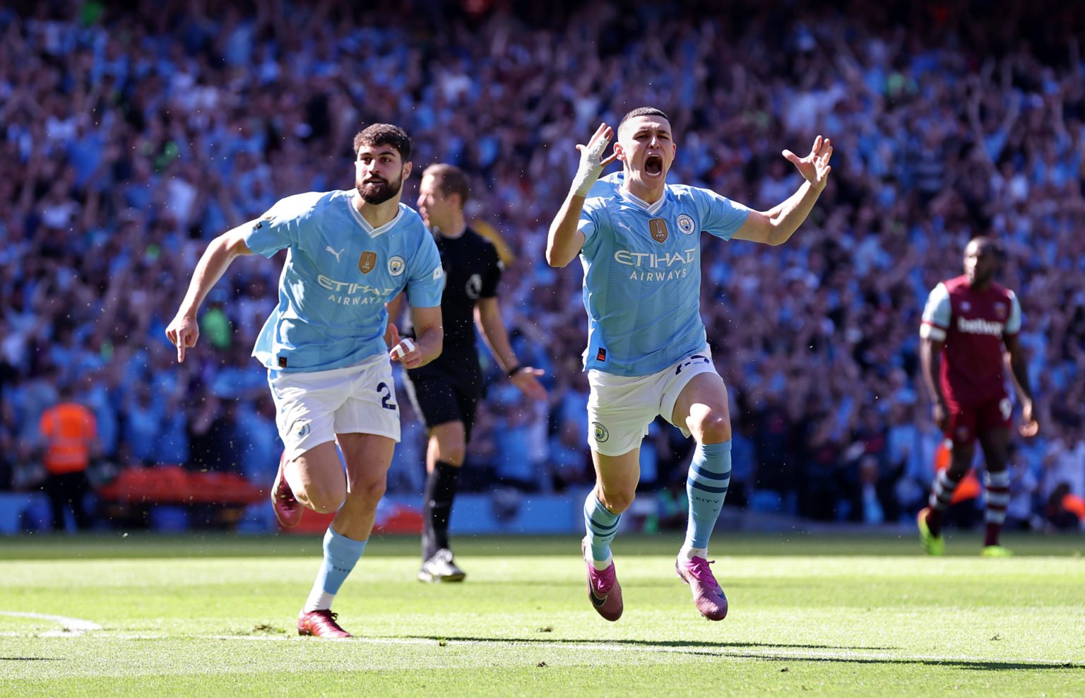 Phil Foden of Manchester City celebrates after scoring the opening goal during the Premier League match between Manchester City and West Ham United...