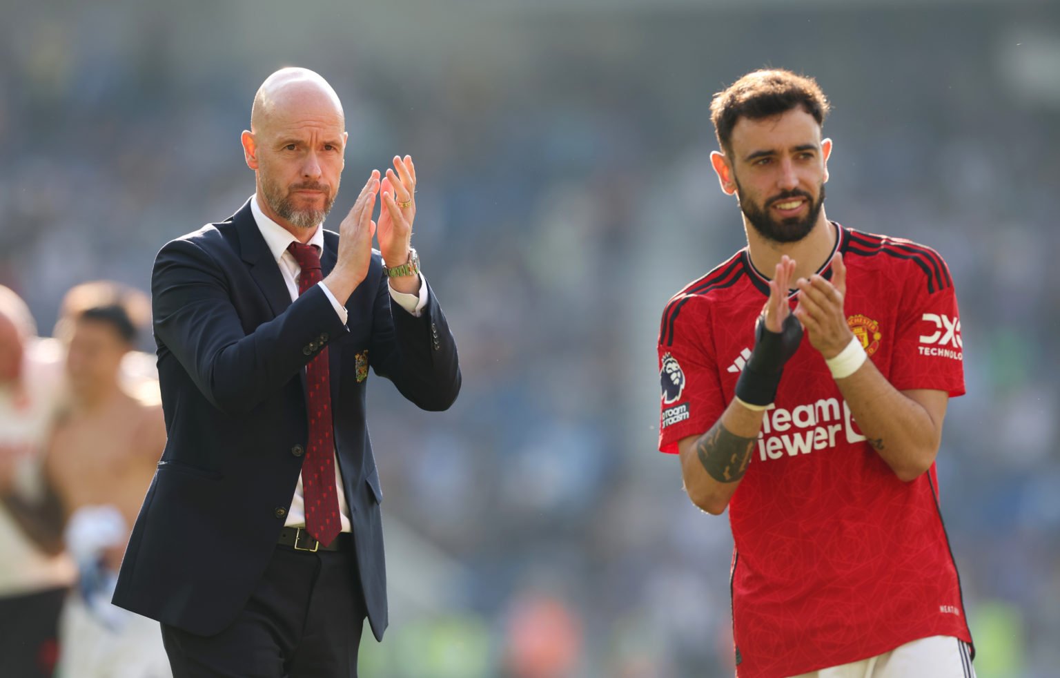 Erik ten Hag, Manager of Manchester United, applauds the fans alongside Bruno Fernandes of Manchester United after the team's victory in the Premie...