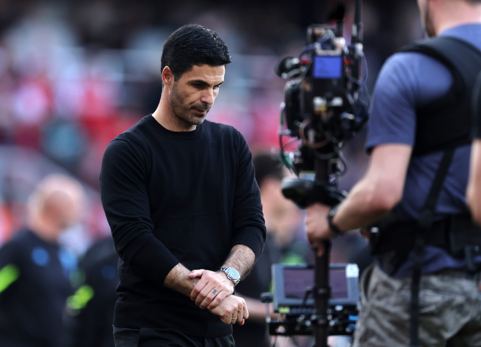 Mikel Arteta the head coach / manager of Arsenal looks downcast as he walks around the pitch in the lap of appreciation after the Premier League ma...