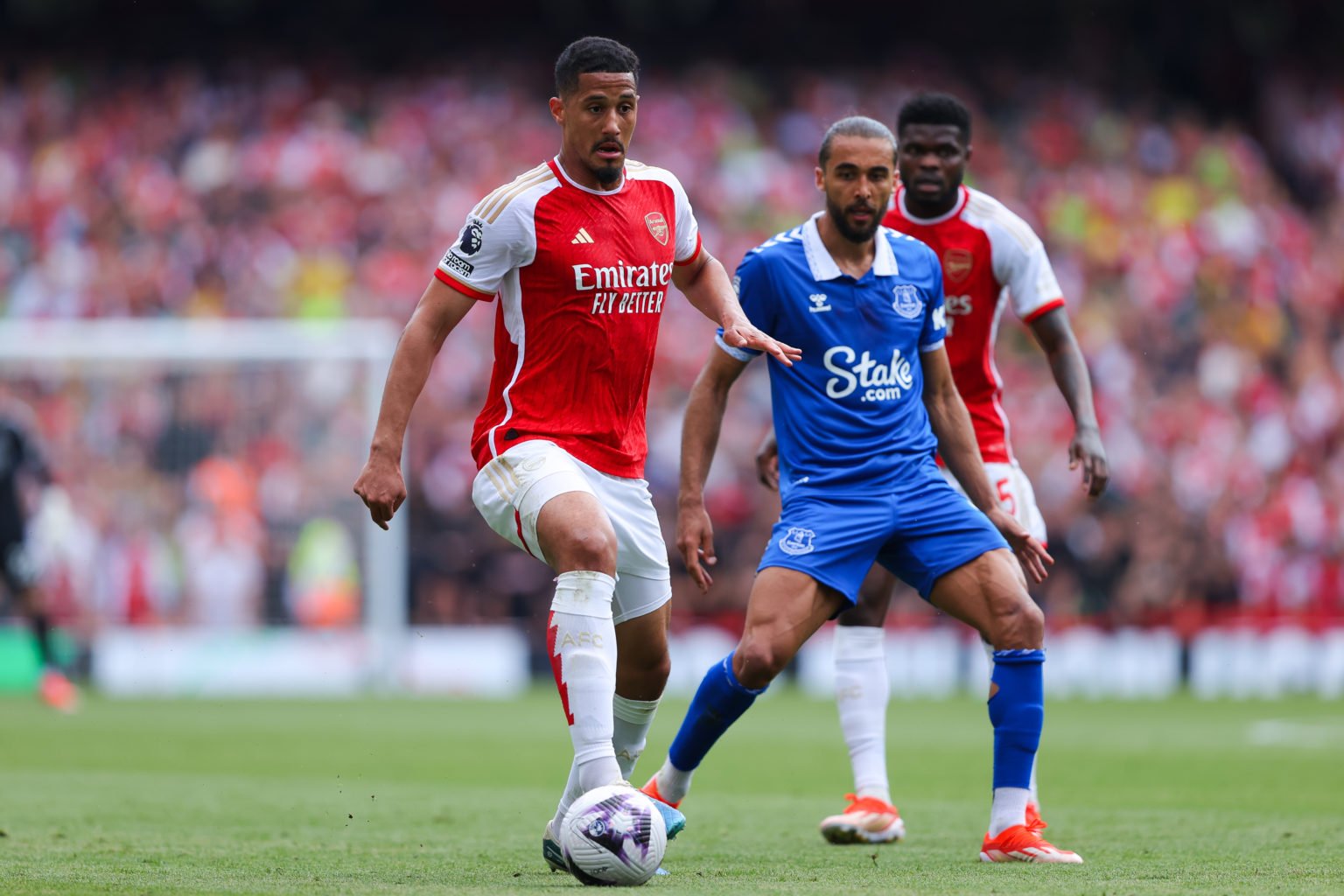 William Saliba of Arsenal runs under pressure from Dominic Calvert-Lewin of Everton during the Premier League match between Arsenal FC and Everton ...