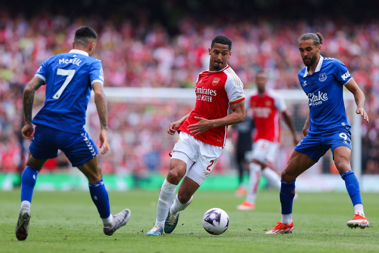 William Saliba of Arsenal runs under pressure from Dominic Calvert-Lewin of Everton during the Premier League match between Arsenal FC and Everton ...