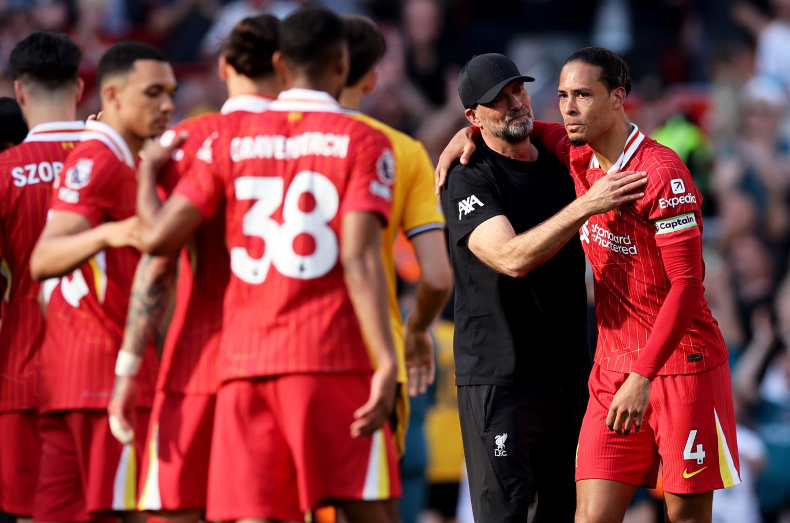 Jurgen Klopp, Manager of Liverpool, and Virgil van Dijk of Liverpool embrace after the team's victory in the Premier League match between Liverpool...