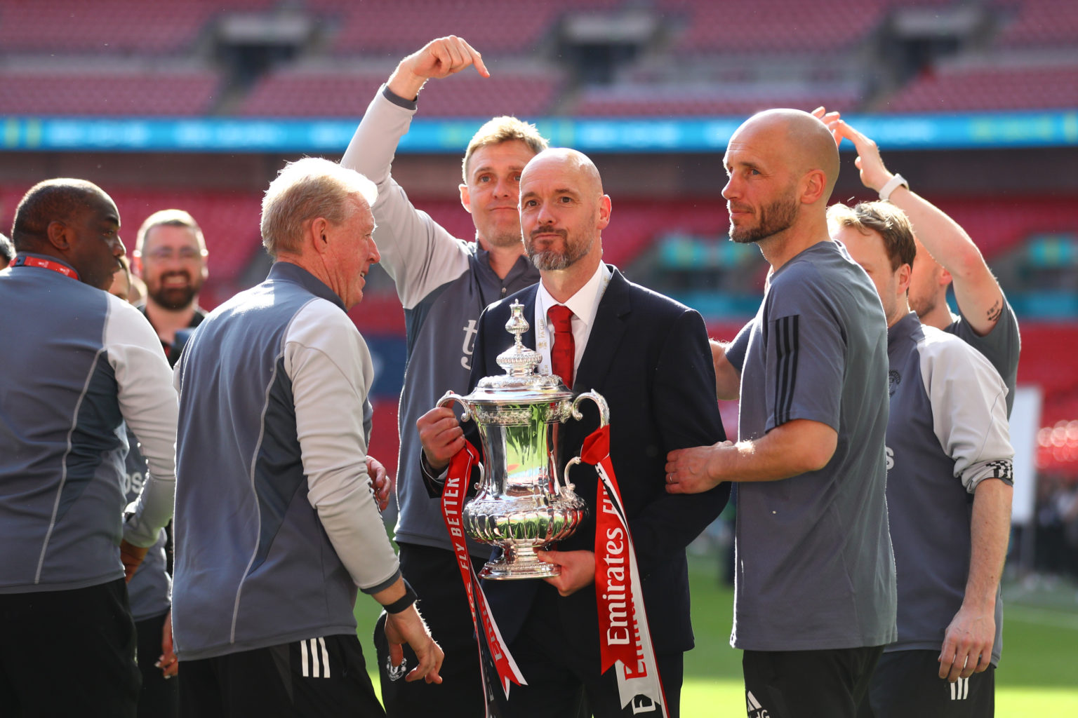 Manchester United manager Erik ten Hag celebrates with the FA Cup Trophy during the Emirates FA Cup Final match between Manchester City and Manches...