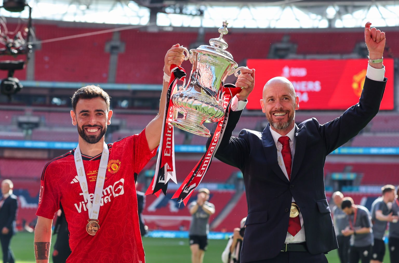 Manchester United's captain Bruno Fernandes and manager Erik ten Hag  celebrate after the Emirates FA Cup Final match between Manchester City and M...