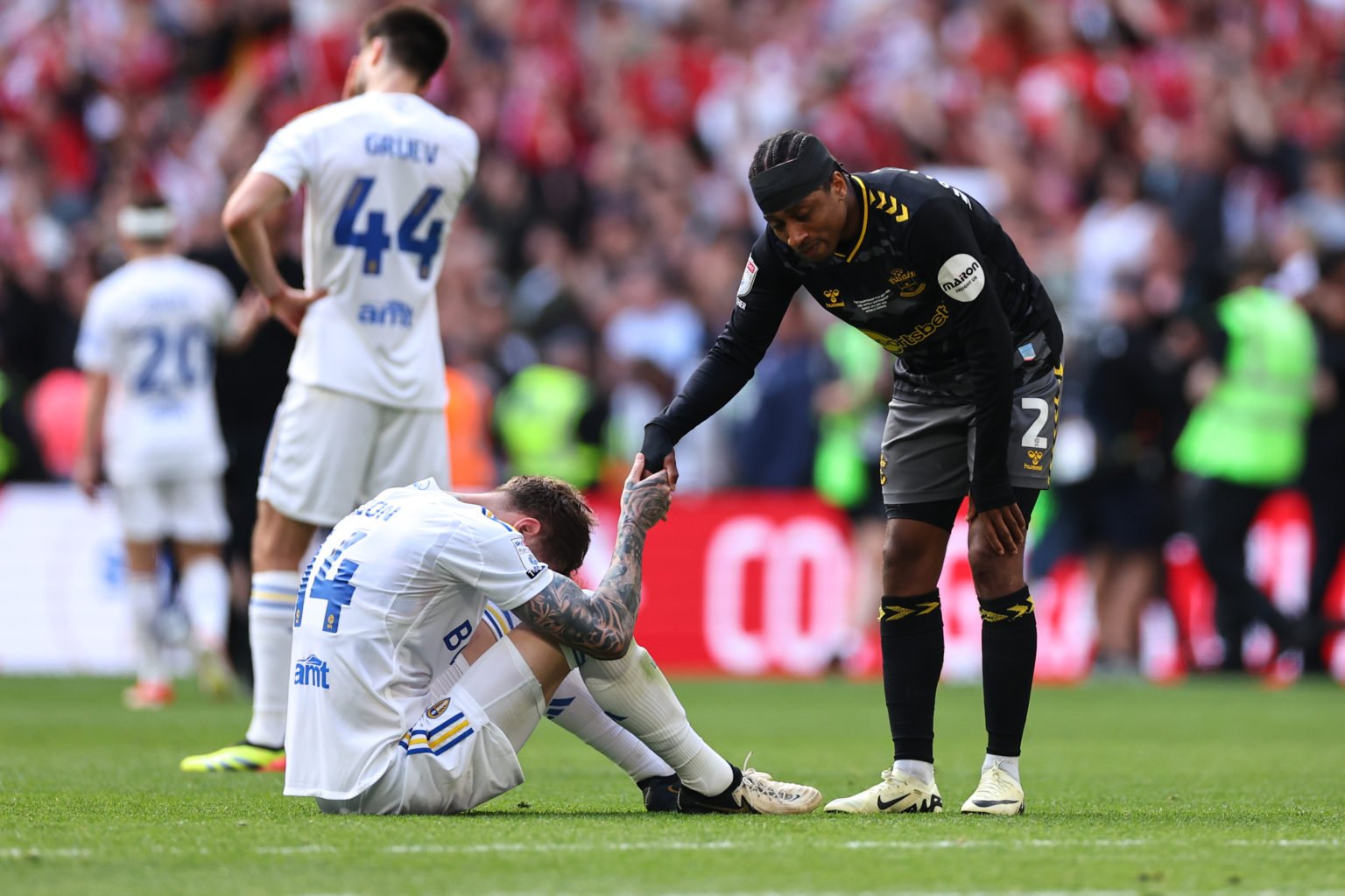 Kyle Walker-Peters of Southampton consoles dejected players of Leeds United at full time as Southampton win the Sky Bet Championship Play-off Final...