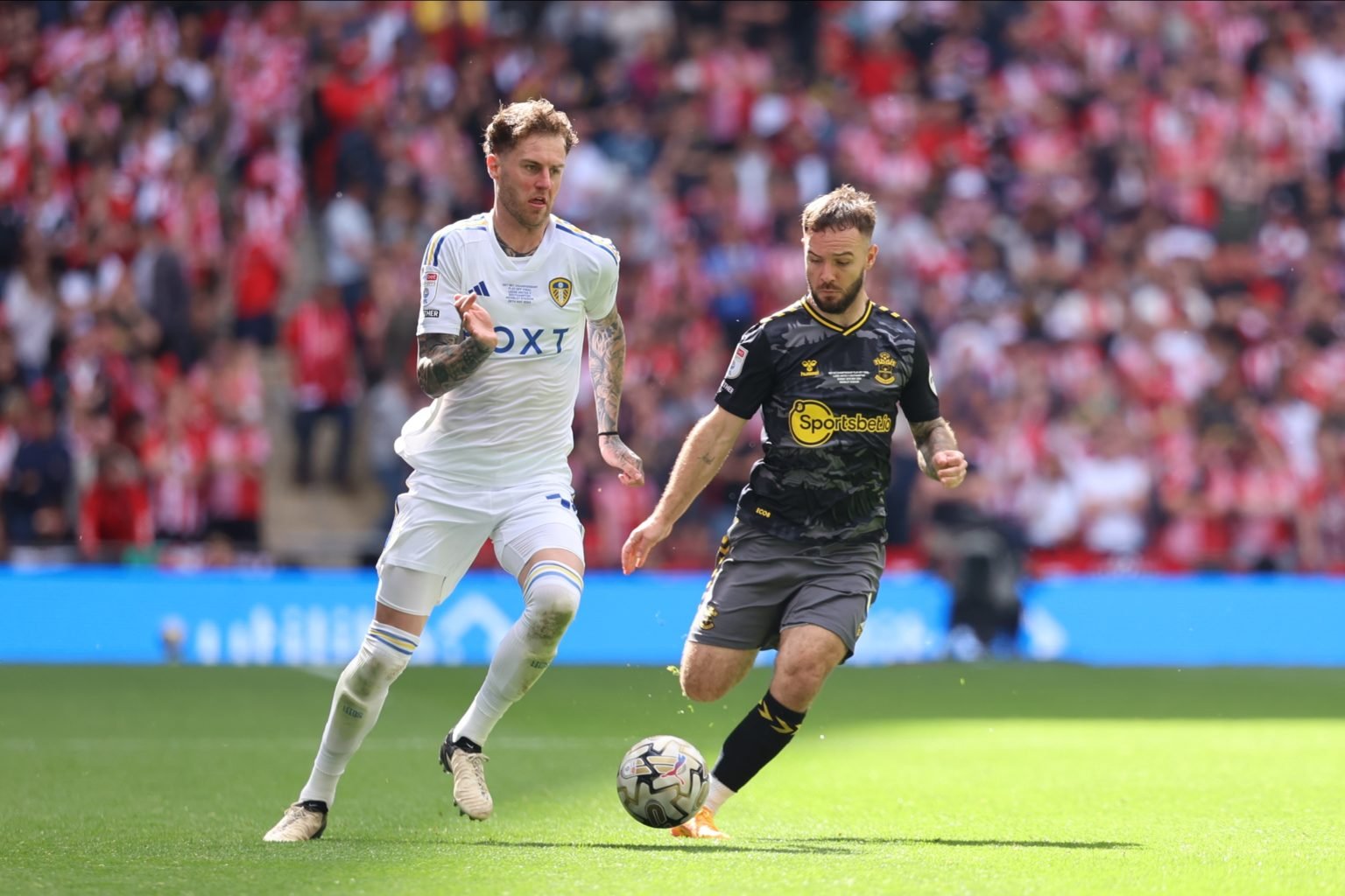 Joe Rodon (Leeds United) is taking on Adam Armstrong (Southampton) during the SkyBet Championship Playoff Final between Leeds United and Southampto...