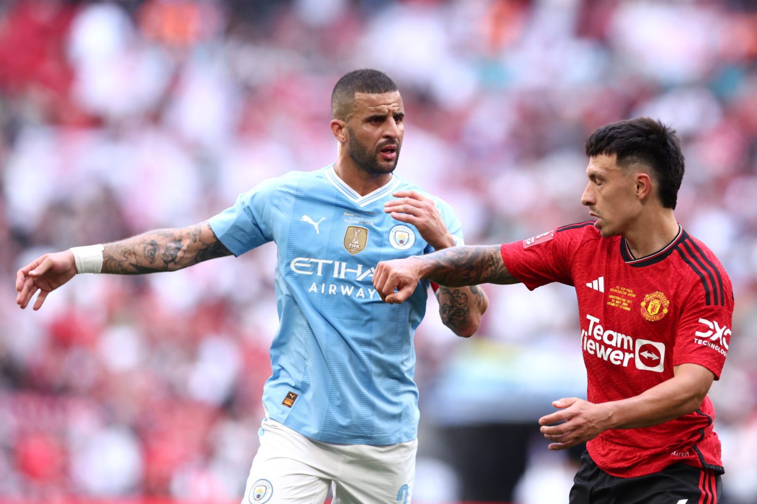 Kyle Walker of Manchester City and Lisandro Martinez of Manchester United clash during the Emirates FA Cup Final match between Manchester City and ...