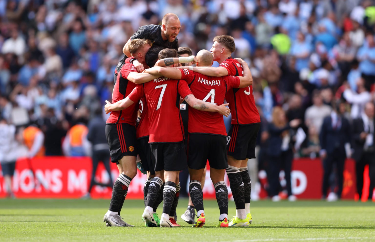 Manchester United players celebrate following the team's victory in the Emirates FA Cup Final match between Manchester City and Manchester United a...