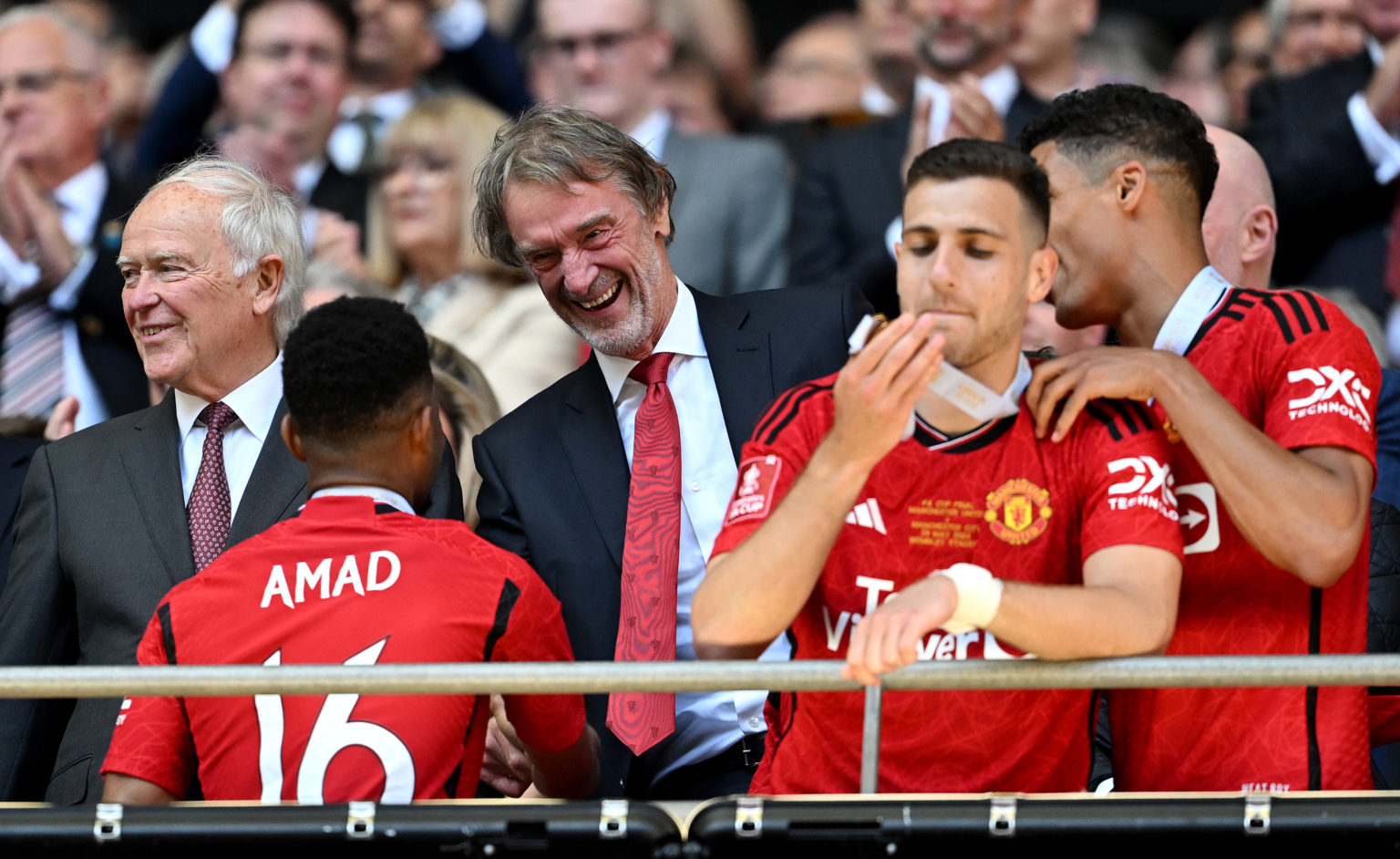 Sir Jim Ratcliffe, minority owner of Manchester United shakes hands with Amad Diallo of Manchester United, after the Emirates FA Cup Final match be...