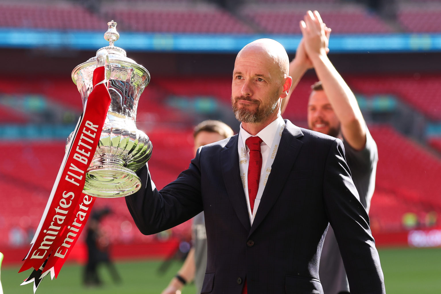 Erik ten Hag, manager of Manchester United, celebrates with the FA Cup trophy after the Emirates FA Cup Final match between Manchester City and Man...