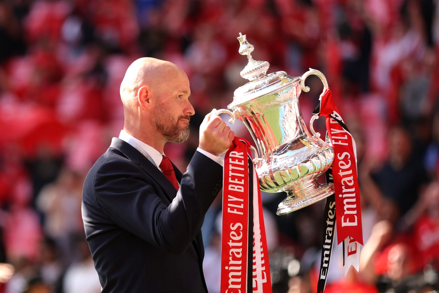 Erik ten Hag, Manager of Manchester United celebrates with the trophy during the Emirates FA Cup Final match between Manchester City and Manchester...